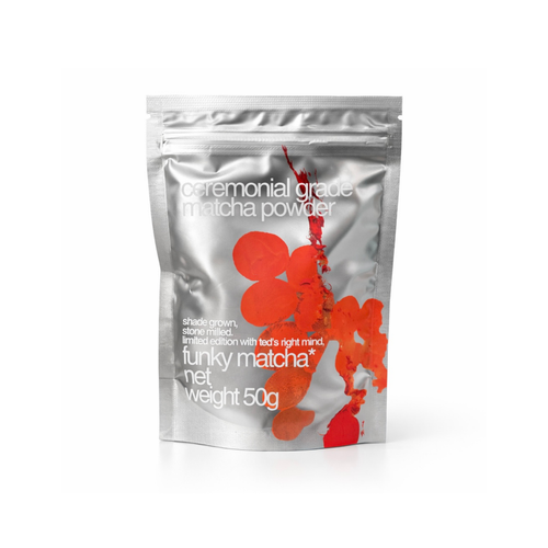 A silver foil stand-up pouch for matcha powder features abstract red circular and organic shapes against a metallic background.